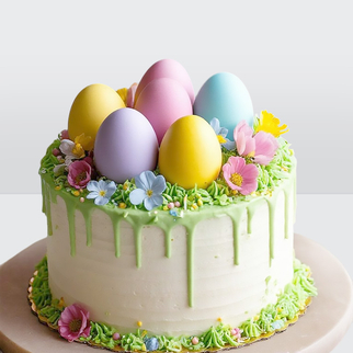 Торт на пасху с цветными яйцами из шоколада и цветами