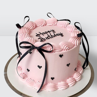 Торт ламбет розовый с черными ленточками сердечками и надписью