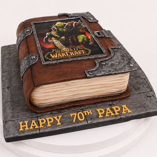 Торт магическая книга по мотивам и с эмблемой игры WarCraft на юбилей
